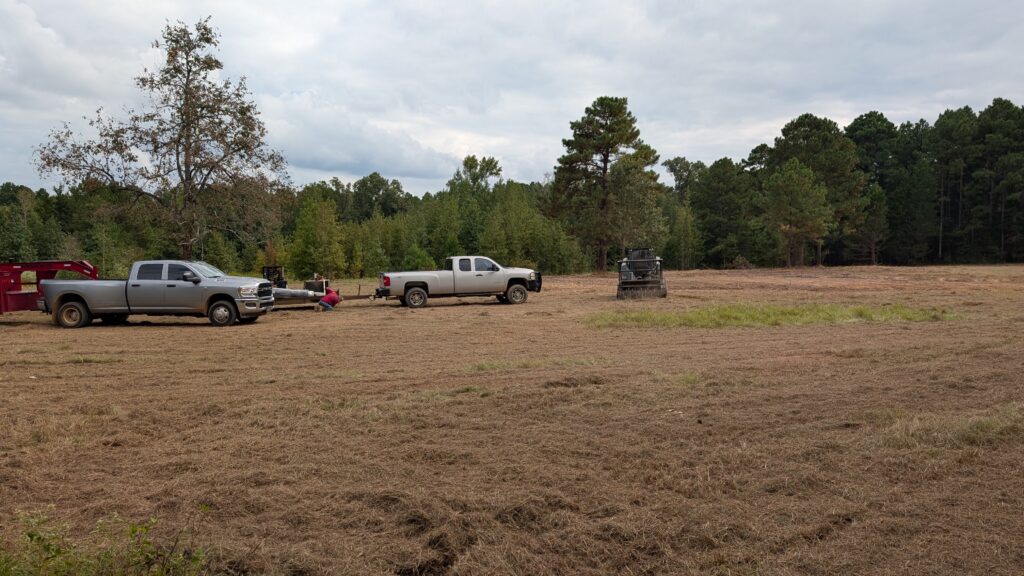 Land Clearing Project with Pickup Trucks and Equipment